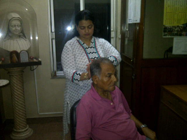 Arpita giving Reiki to Mr. Dasgupta