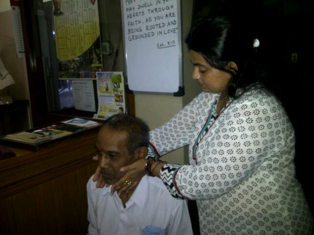 2. Arpita giving healing to Mr Taraknath