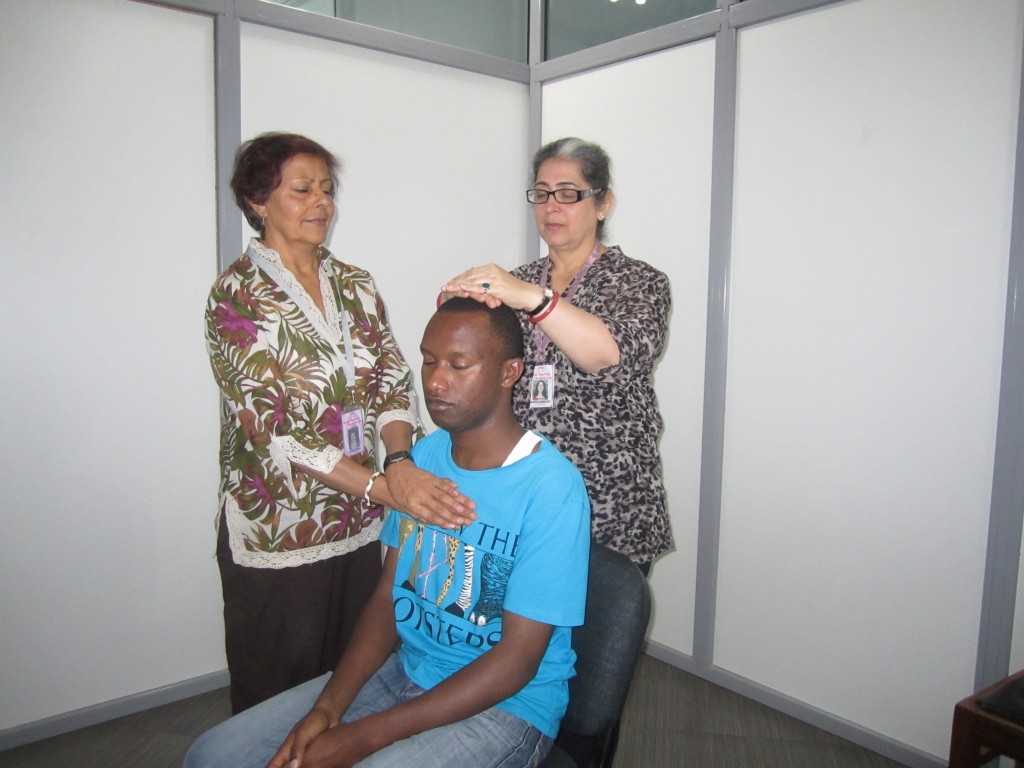 Simon Muli relaxes with the healing hands of energy.